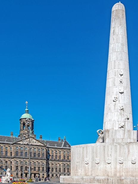 Dam Square with National Monument and Royal Palace in Amsterdam.