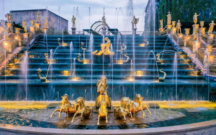 Helios Waterfall with golden statues and fountains at Sun World Ba Na Hills, Da Nang, Vietnam.