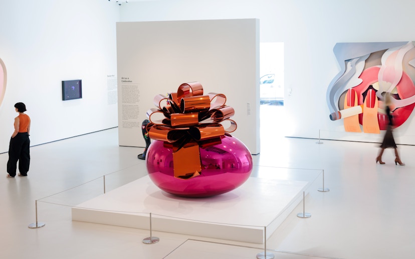 Moco Museum London interior with large pink sculpture and modern art displays.