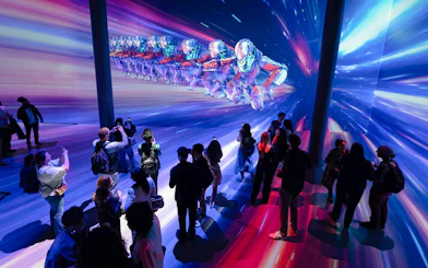 Guests viewing digital art installation at ARTECHOUSE DC exhibit.