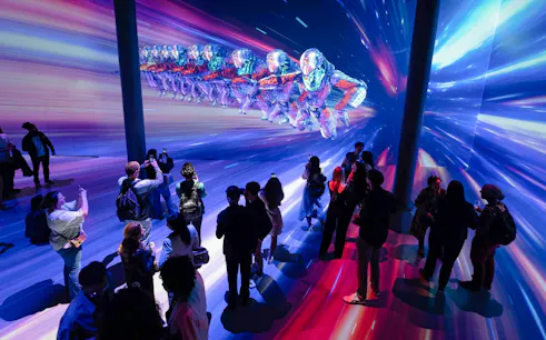 Guests viewing digital art installation at ARTECHOUSE DC exhibit.
