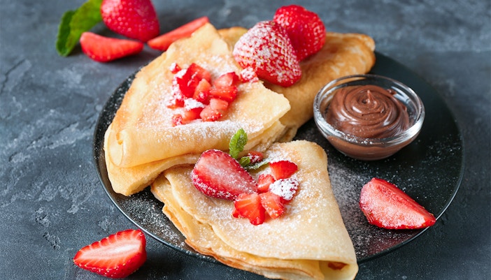 Crepes with strawberries and chocolate sauce at Disneyland Paris restaurant.