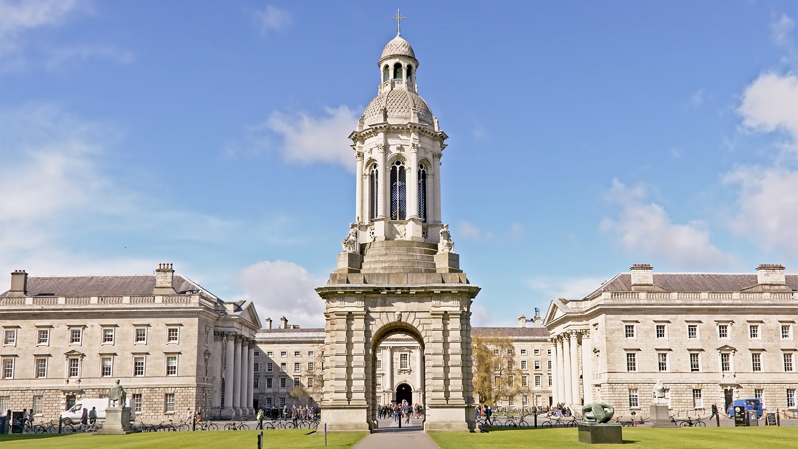 Trinity College Dublin with Dublin Big Bus tour in foreground