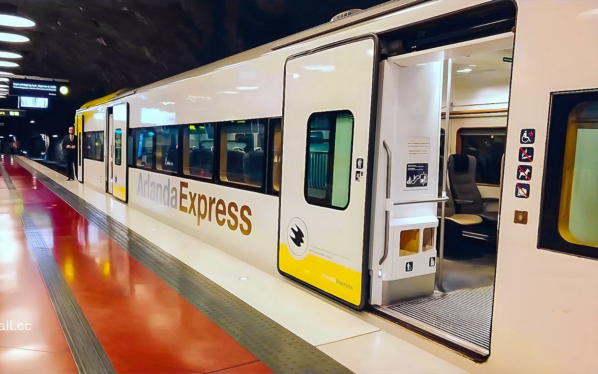 Stockholm Arlanda Express train at underground station platform.