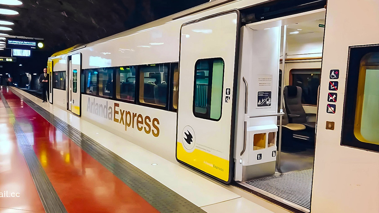 Stockholm Arlanda Express train at underground station platform.