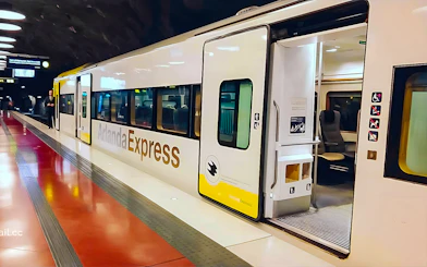 Stockholm Arlanda Express train at underground station platform.