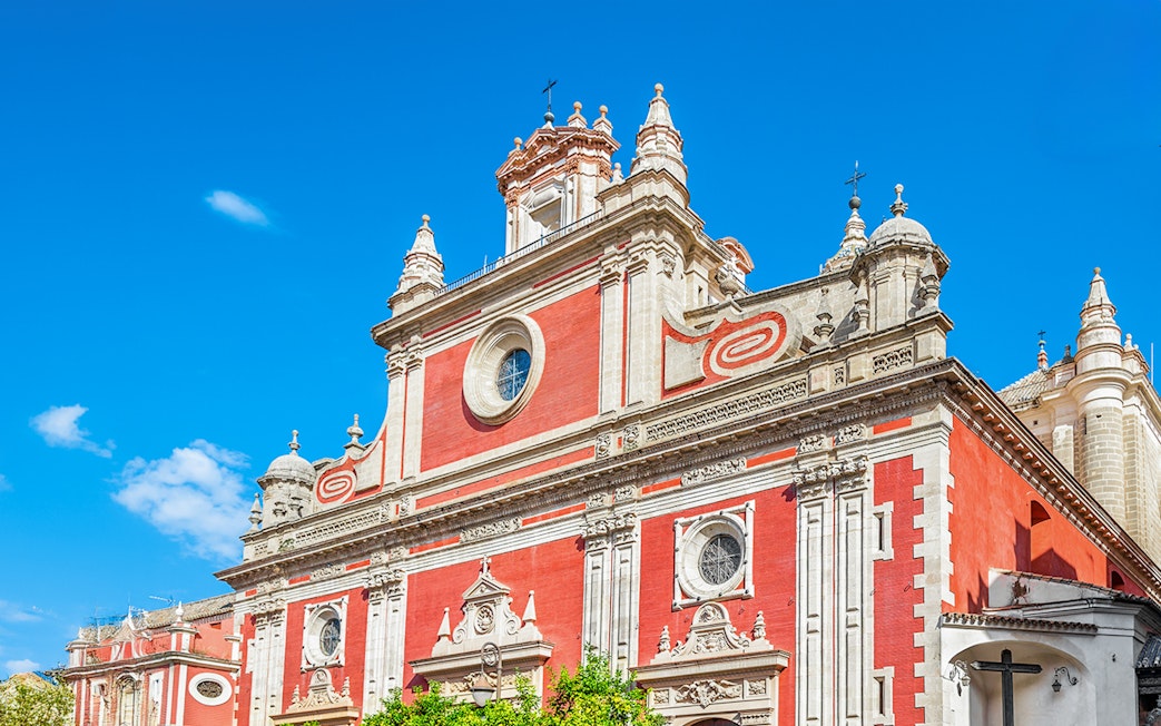Church of El Salvador facade in Seville with ornate architectural details.