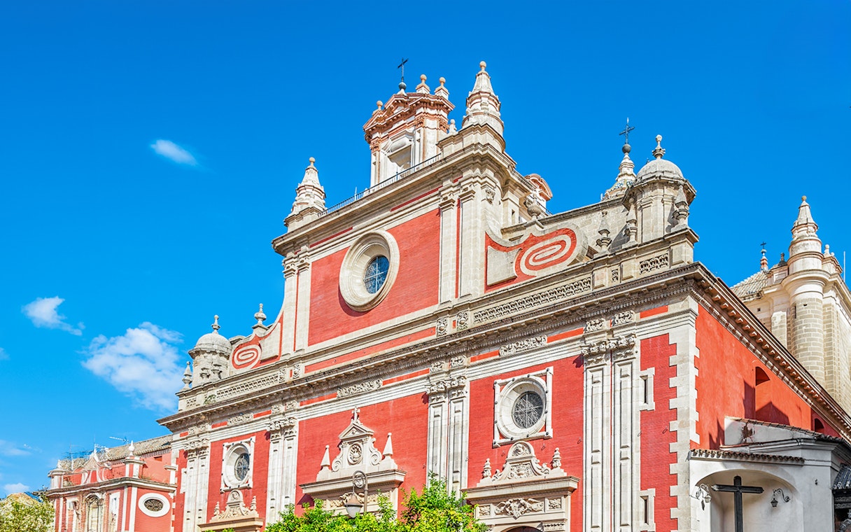 Church of El Salvador facade in Seville with ornate architectural details.