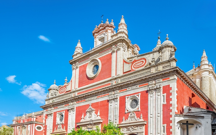 Church of El Salvador facade in Seville with ornate architectural details.