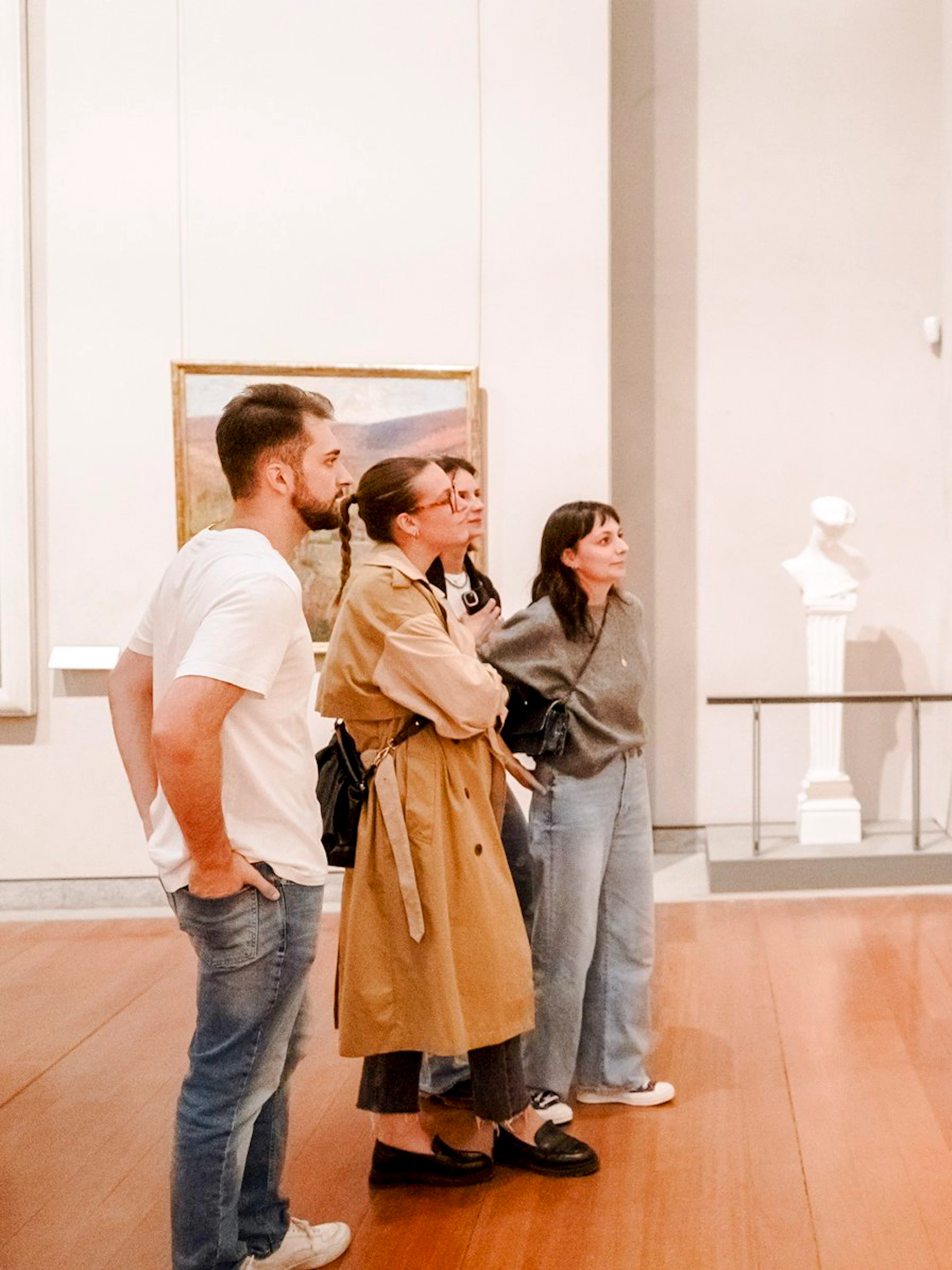 Visitors observing paintings at the Museum of Fine Arts, Lyon, France.