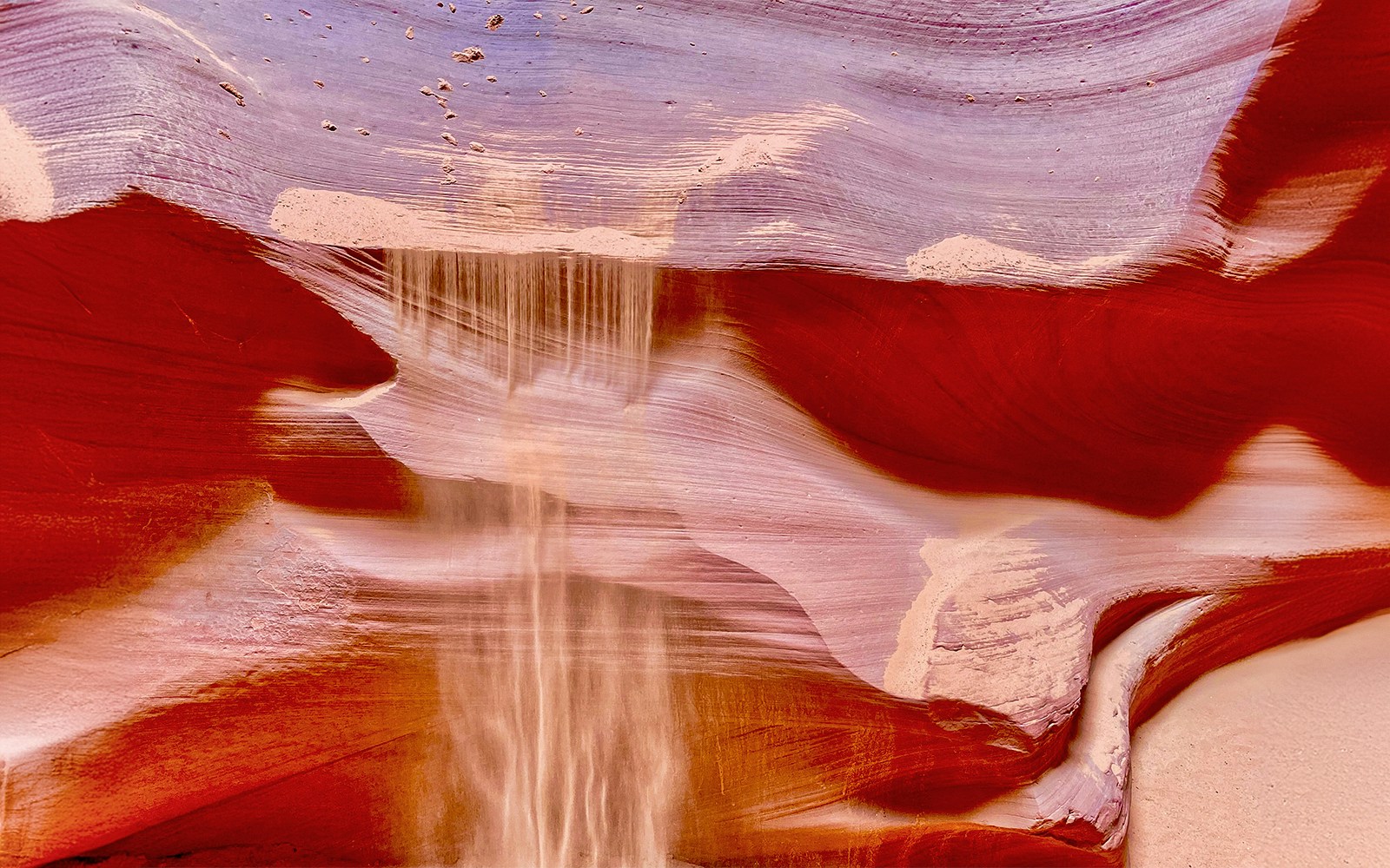 Antelope Canyon X sandstone formations with light beams in Arizona.