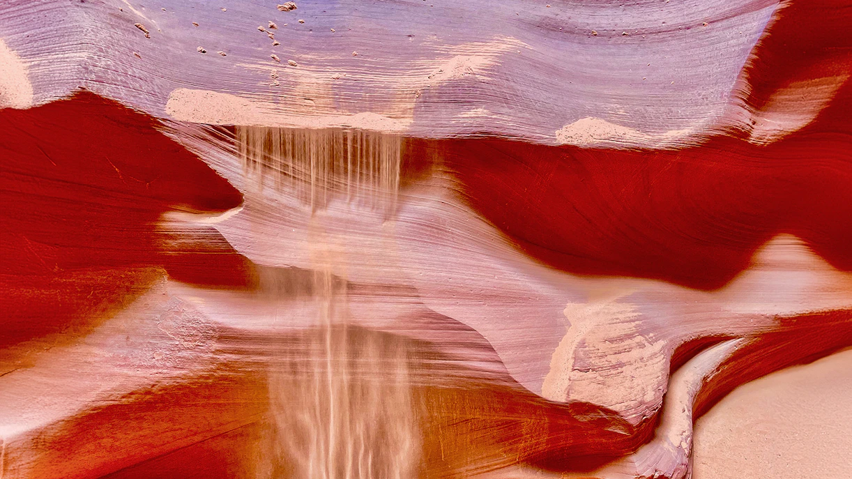 Antelope Canyon X sandstone formations with light beams in Arizona.