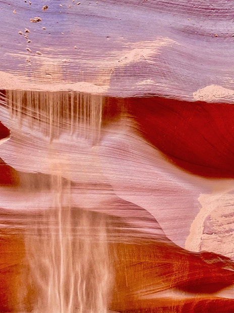 Antelope Canyon X sandstone formations with light beams in Arizona.