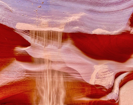 Antelope Canyon X sandstone formations with light beams in Arizona.