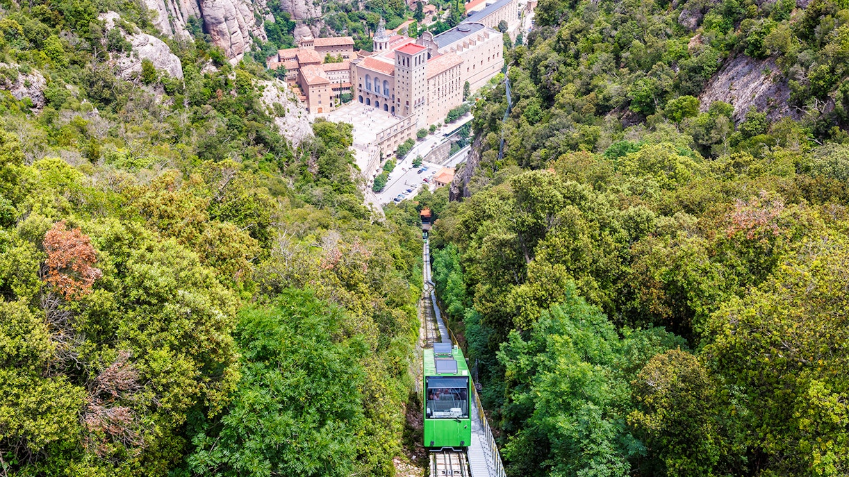 Montserrat Monastery with cog-wheel train and scenic mountain views on guided tour.