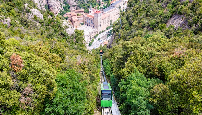 Montserrat Monastery with cog-wheel train and mountain views on guided tour.