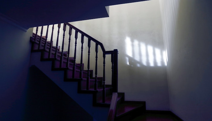 Staircase in a haunted place with dark corridors