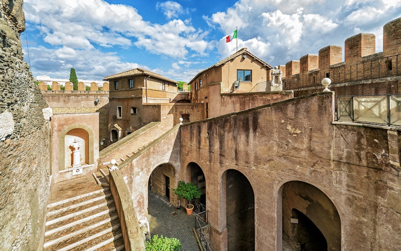 Castel Sant'Angelo courtyard with Italian flag, Rome, Italy.