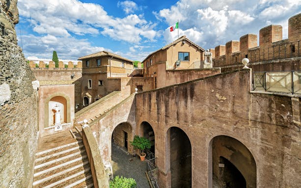Castel Sant'Angelo courtyard with Italian flag, Rome, Italy.