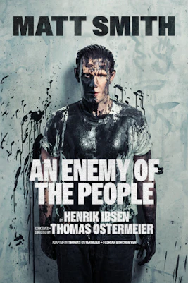 Theater stage with actors performing "An Enemy of the People" in New York City.