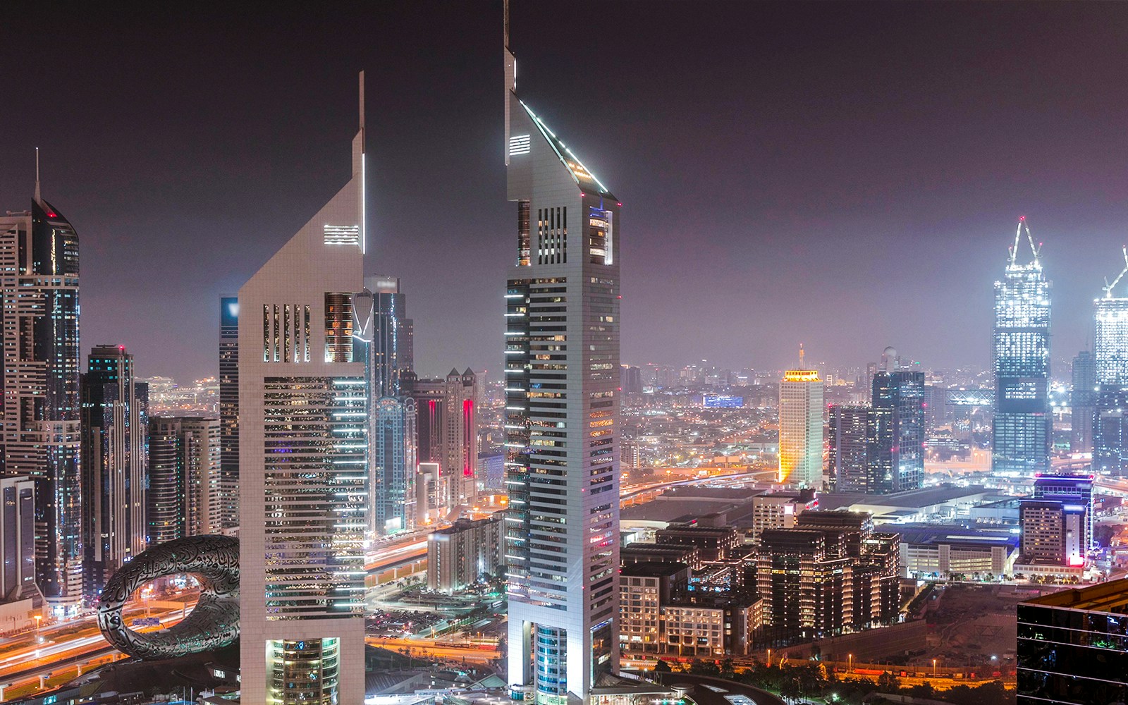 A view of The Emirates Towers at night, Dubai.