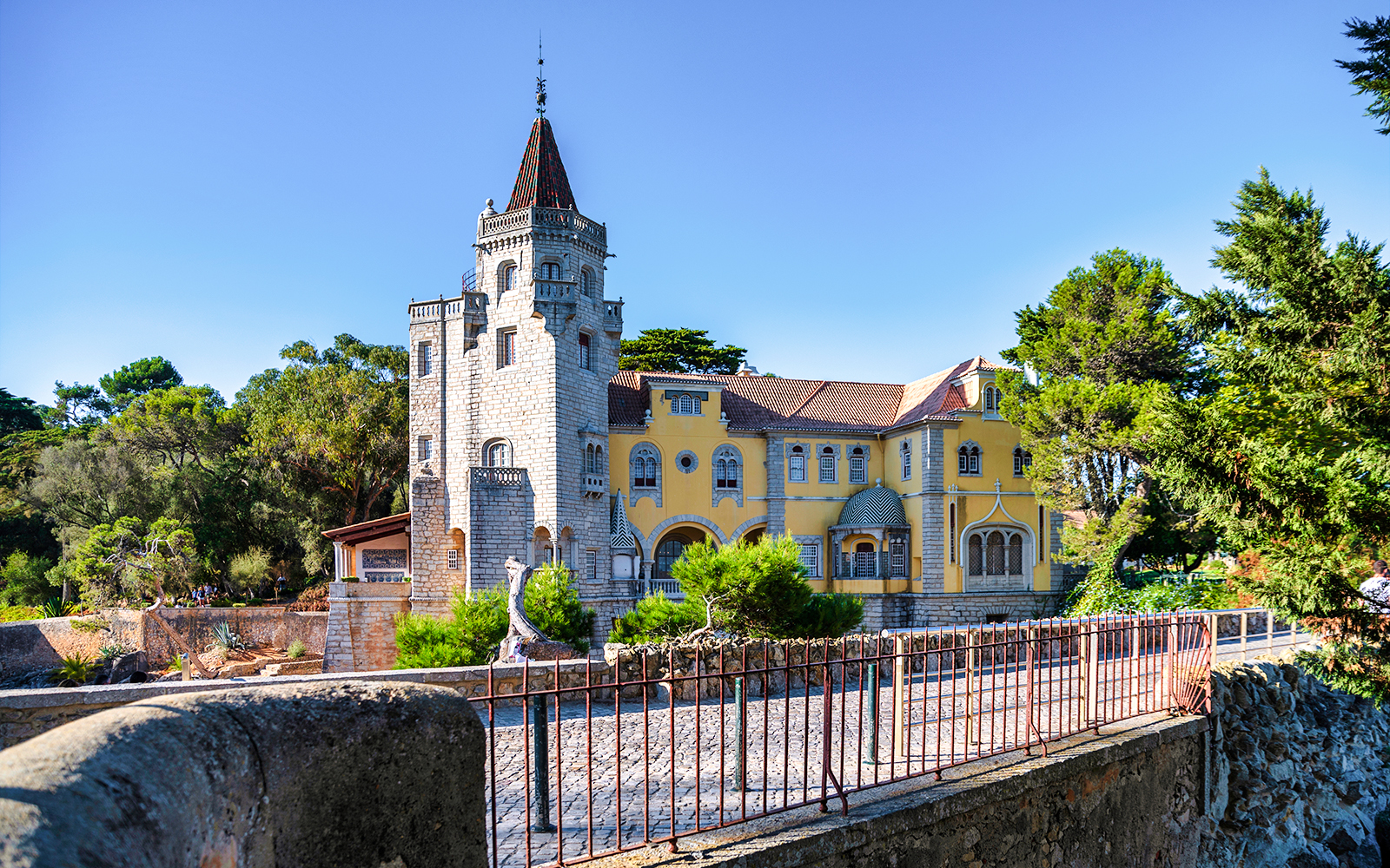 Museu Condes de Castro Guimarães in Cascais with its distinctive tower and yellow facade.
