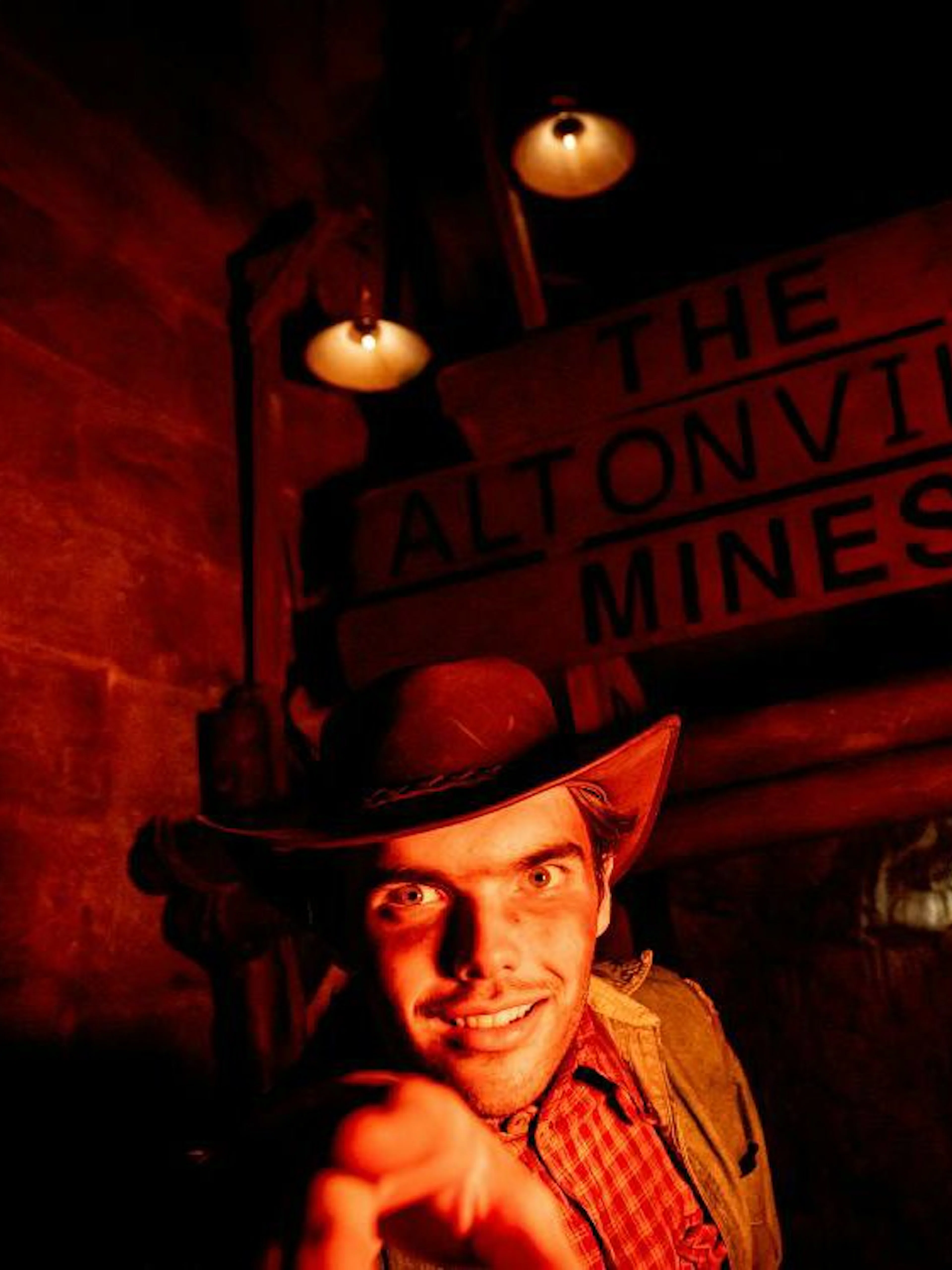 Guide in costume at Altonville Mines during Alton Towers Scarefest.