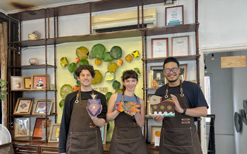 Participants display wooden crafts at Hanoi wood carving workshop.