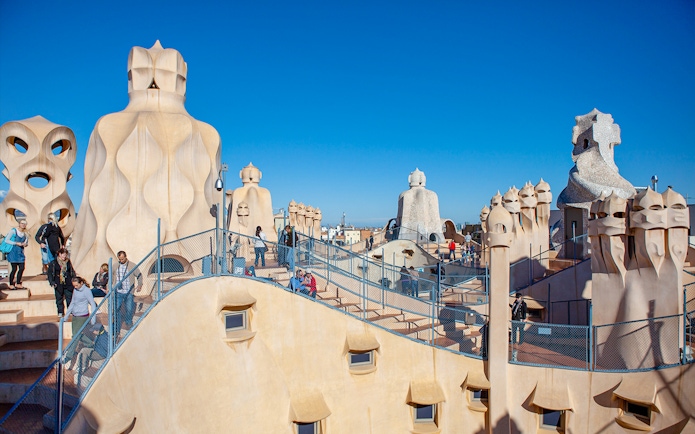 Tourists on Casa Milà rooftop in Barcelona with Turbopass City Card.