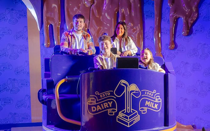 Family enjoying the Cadbury Chocolate Quest ride at Cadbury World.