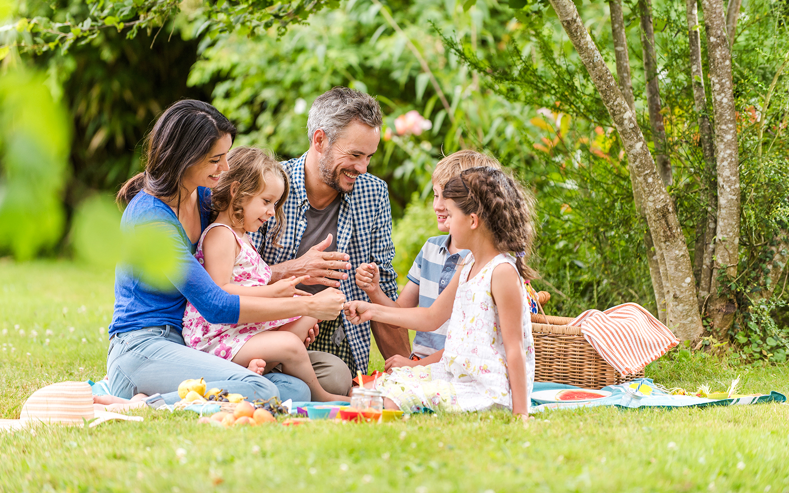 Family enjoying a picnic in Parc du Mont Evrin.