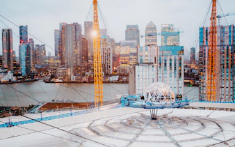 O2 Arena rooftop with snow globe experience overlooking London skyline.