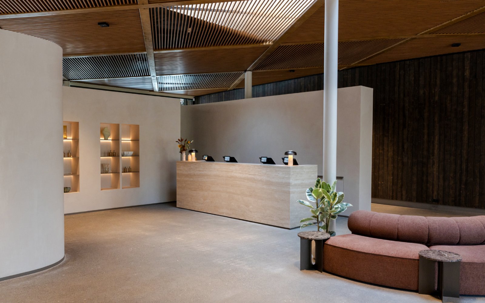 Reception area with modern decor inside Laugarás Lagoon.