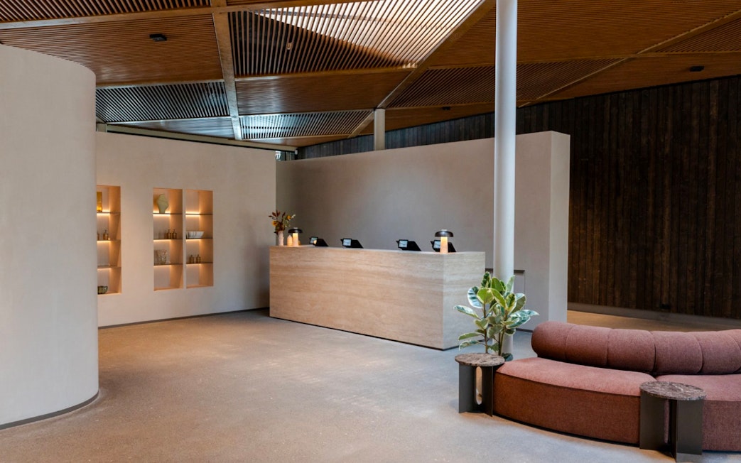 Reception area with modern decor inside Laugarás Lagoon.