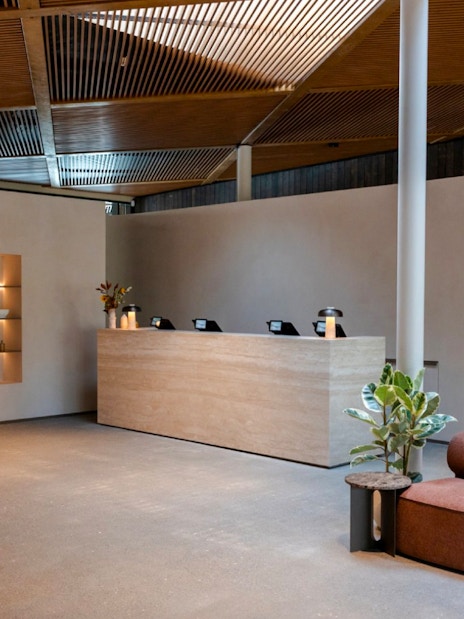 Reception area with modern decor inside Laugarás Lagoon.