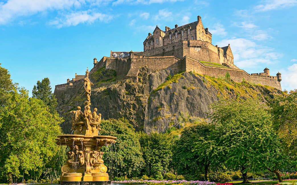 Edinburgh Castle atop Castle Rock with Ross Fountain in foreground on The Royal Edinburgh Tour.