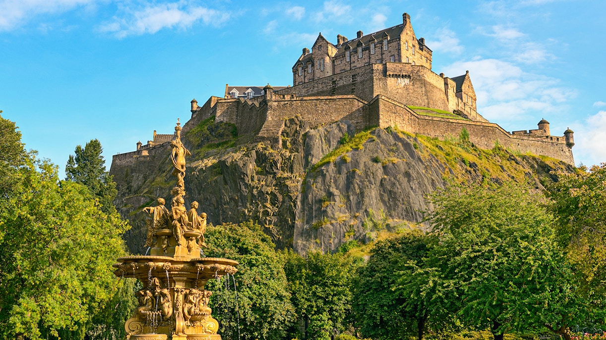 Edinburgh Castle atop Castle Rock with Ross Fountain in foreground on The Royal Edinburgh Tour.