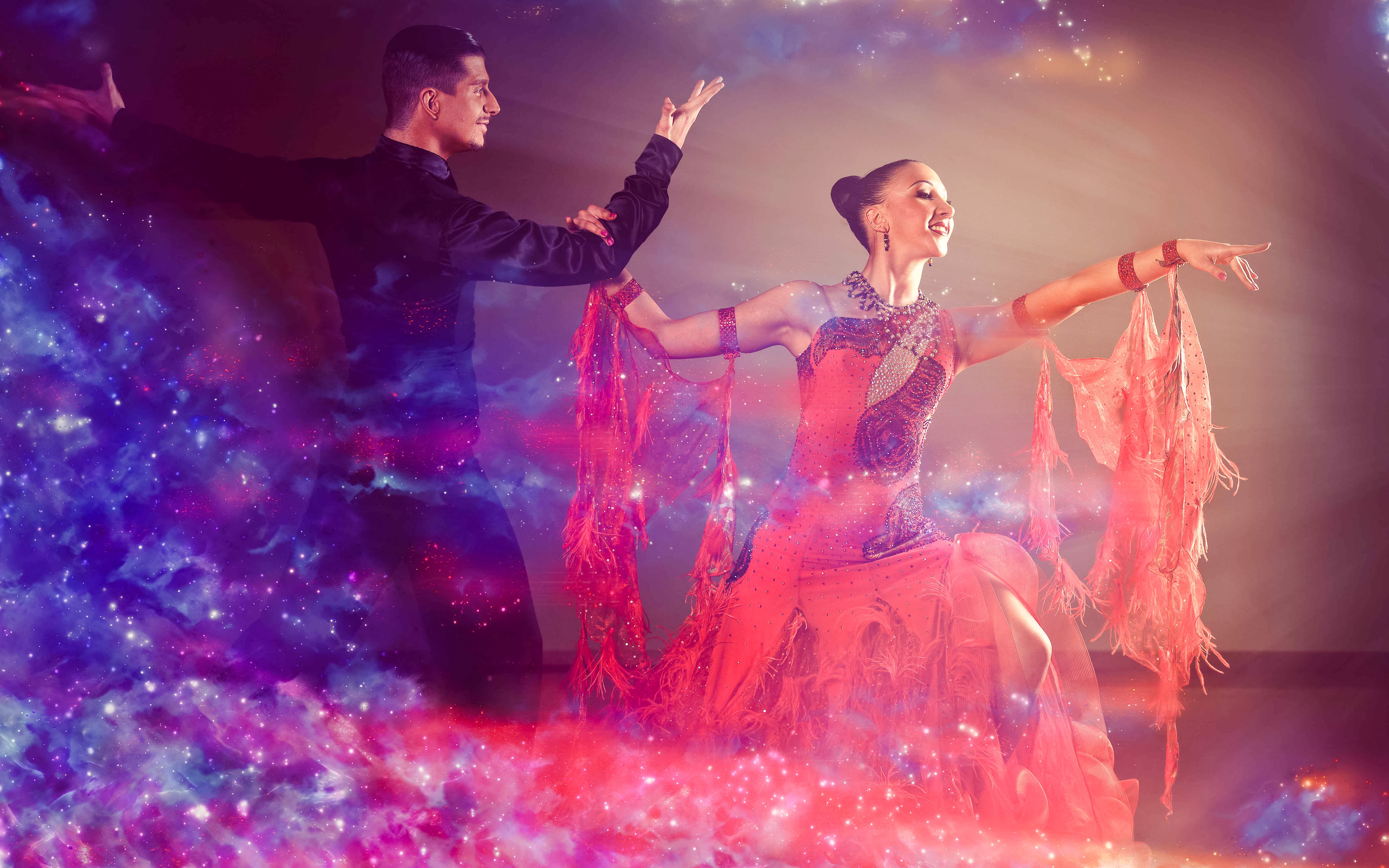 Tango dancers performing with vibrant lighting effects.