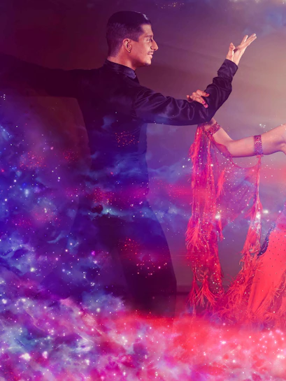 Tango dancers performing with vibrant lighting effects.