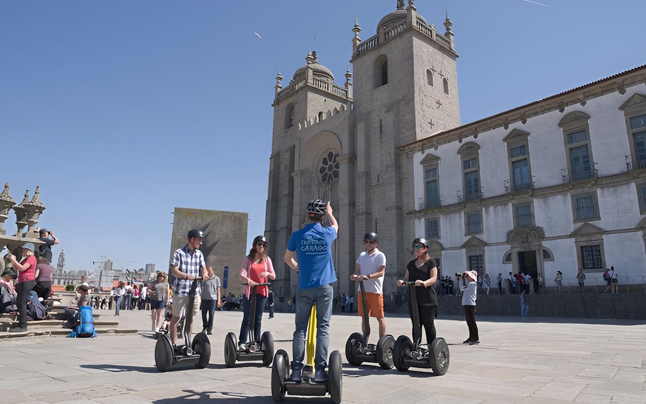 Group on Segways in front of Porto Cathedral during guided tour.
