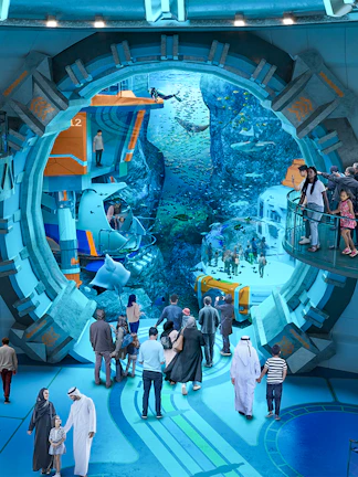 Visitors exploring underwater exhibits at Sea World Abu Dhabi.