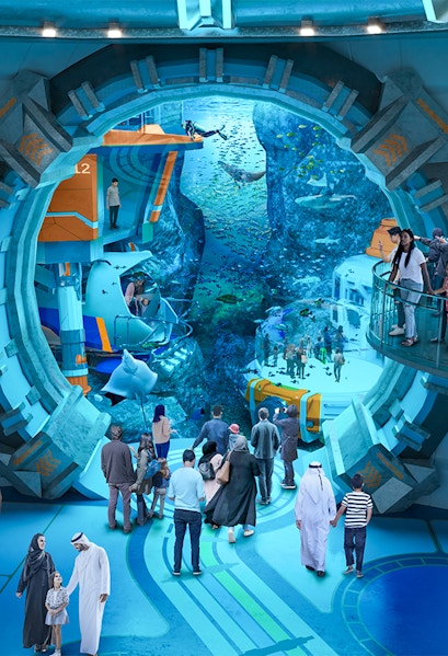 Visitors exploring underwater exhibits at Sea World Abu Dhabi.