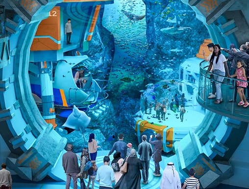 Visitors exploring underwater exhibits at Sea World Abu Dhabi.