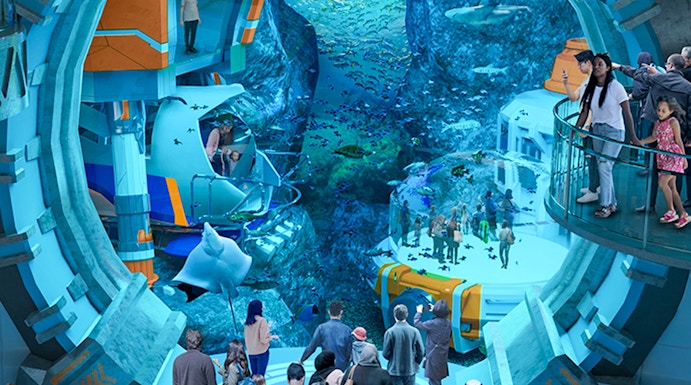 Visitors exploring underwater exhibits at Sea World Abu Dhabi.