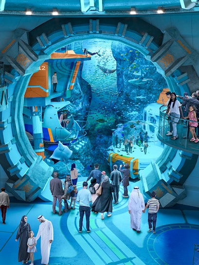 Visitors exploring underwater exhibits at Sea World Abu Dhabi.