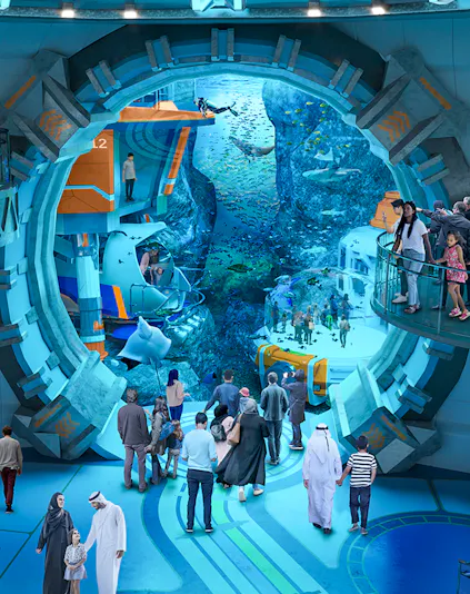 Visitors exploring underwater exhibits at Sea World Abu Dhabi.