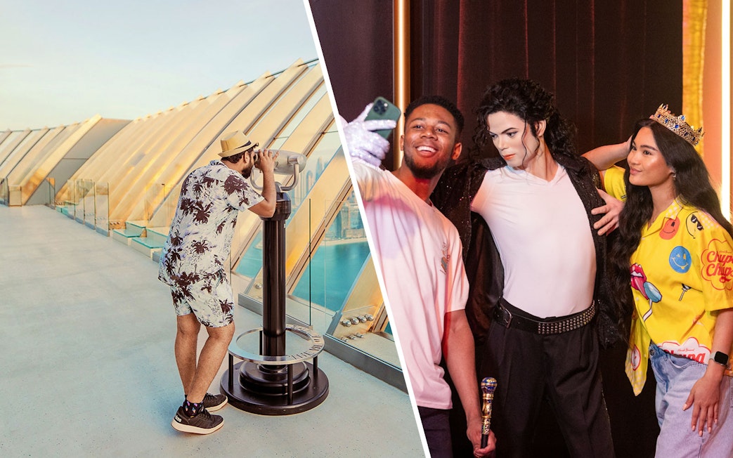 Man viewing skyline through telescope; group taking selfie with wax figure.