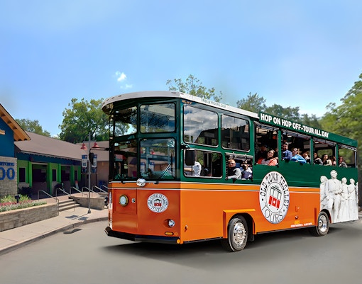 Old Town Trolley near San Antonio Zoo with passengers on board.