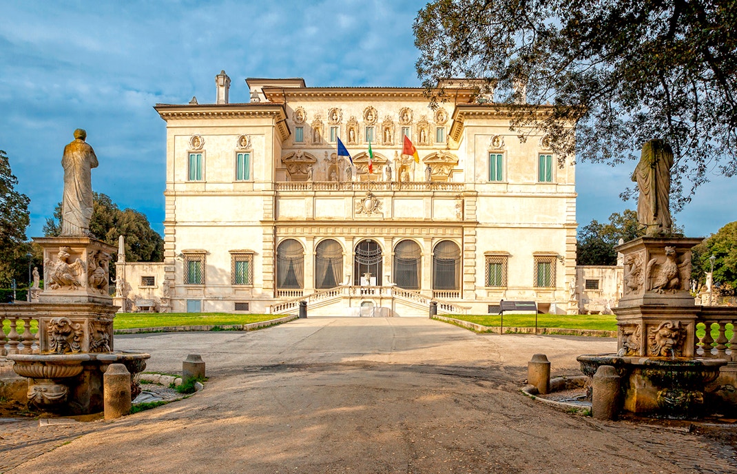 Borghese Gallery facade with statues and garden in Rome, Italy.