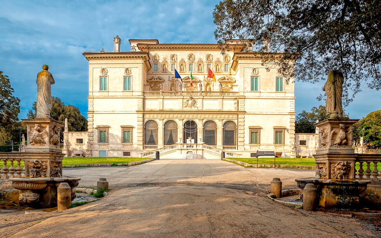 Borghese Gallery facade with statues and garden in Rome, Italy.